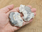 Flower Agate flat gemstone slab featuring cherry blossom patterns, showcasing vibrant colors and intricate crystal details.