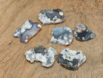 Flower Agate flat gemstone slab featuring cherry blossom patterns, showcasing vibrant pink and white crystal details.