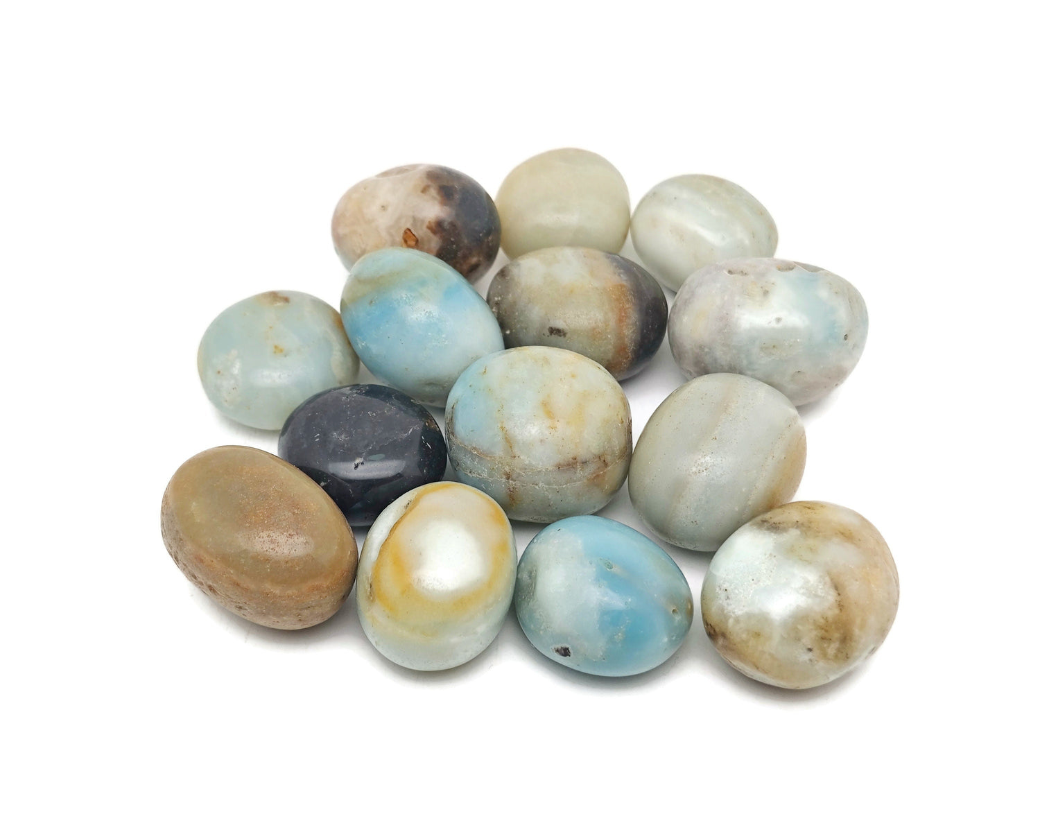 Caribbean calcite tumbled stone from GemstoneGO showing smooth, rounded orange and green mineral with a polished surface.