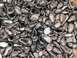 Semi-tumbled hematite crystal chips in 7-12mm, shown in bulk, with a smooth, metallic gray appearance and natural gemstone texture.