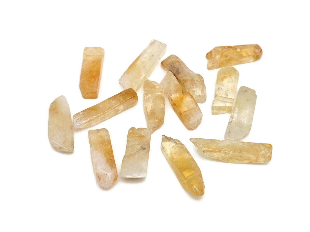 Citrine drilled tumbled gemstone pendant from GemstoneGO, showcasing a bright yellow, polished stone with a natural drilled hole.
