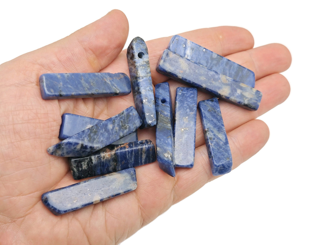 Sodalite drilled tumbled gemstone pendant from GemstoneGO, showcasing deep blue and white natural stone with drilled hole for jewelry.