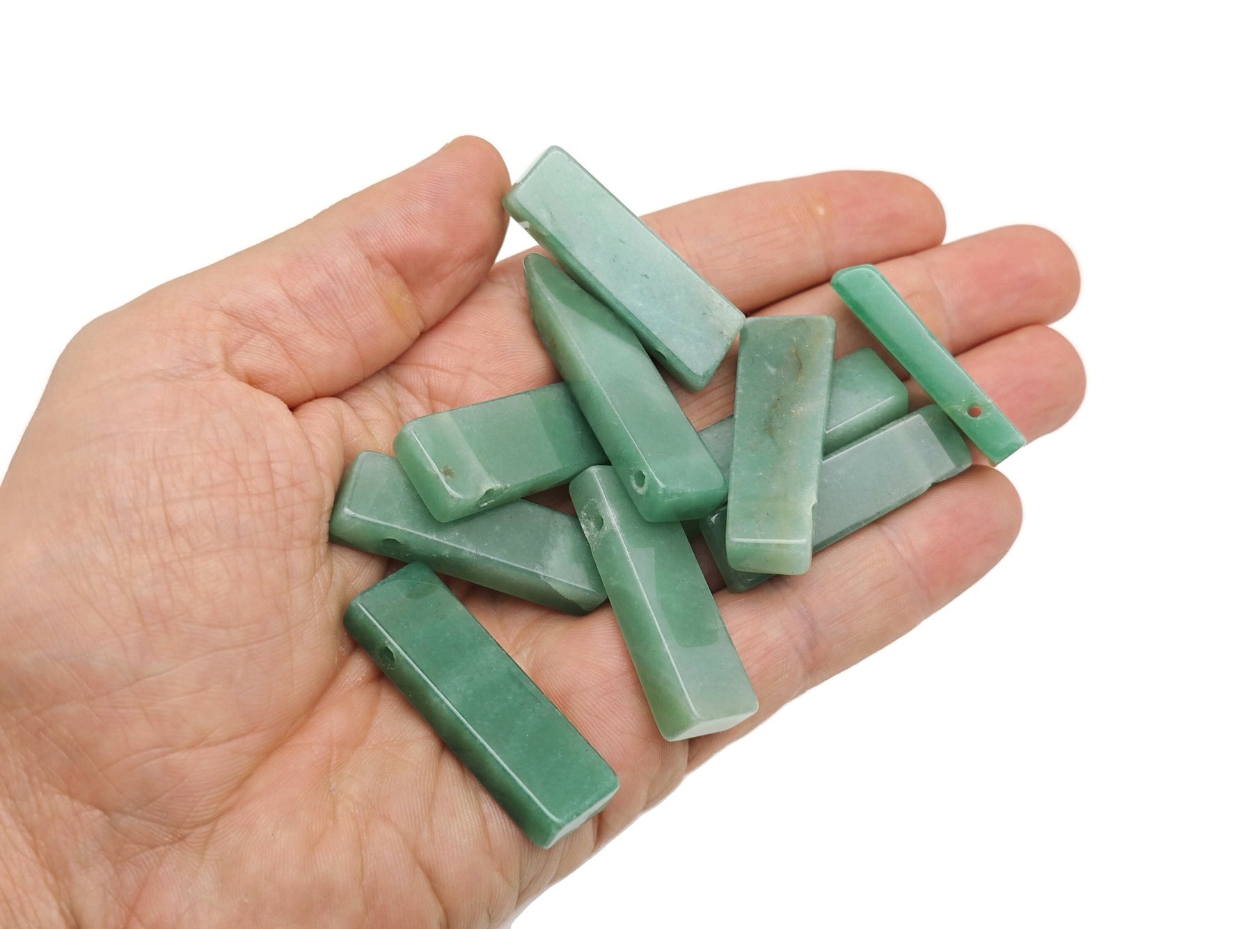Aventurine drilled tumbled gemstone pendant from GemstoneGO, showcasing a smooth green stone with natural patterns and drill hole for jewelry.