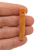 Orange aventurine drilled tumbled gemstone pendant from GemstoneGO, showcasing a smooth, polished orange stone with drilled hole for jewelry.