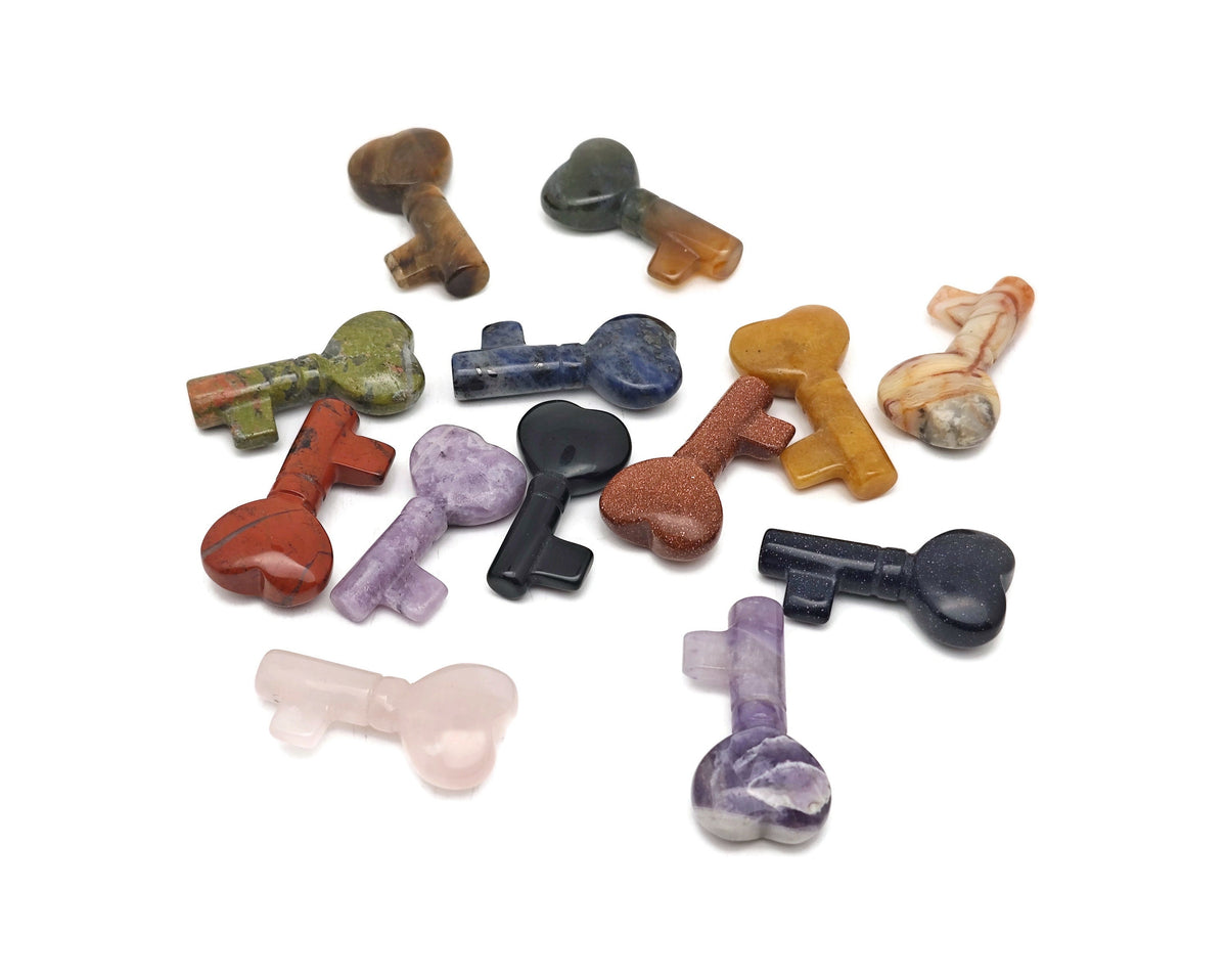 Colorful gemstone carving keychain featuring a 40mm crystal from GemstoneGO, used for meditation, chakra balancing, and energy healing.