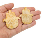 Evil Eye hand gemstone carving, pocket crystal for chakra healing and meditation, featuring colorful mixed crystals.