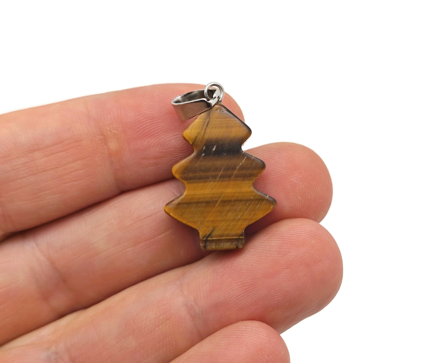 Mini Tiger Eye gemstone pendant featuring a pine tree design, crafted by GemstoneGO, showcasing warm amber tones and detailed craftsmanship.