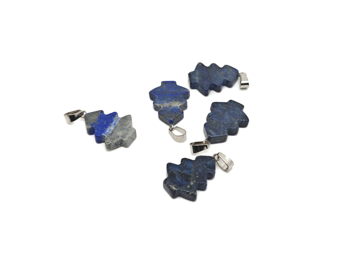 Lapis Lazuli gemstone pendant featuring a pine tree design, mini crystal pendant from GemstoneGO, shown against a neutral background