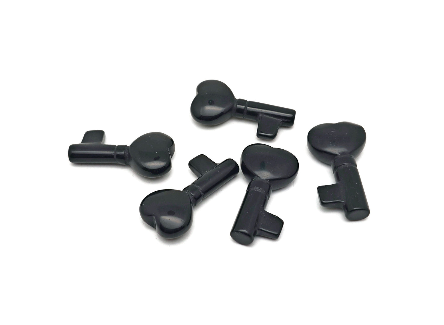 Obsidian key gemstone carving, 40mm, from GemstoneGO, featuring detailed craftsmanship and polished surface.