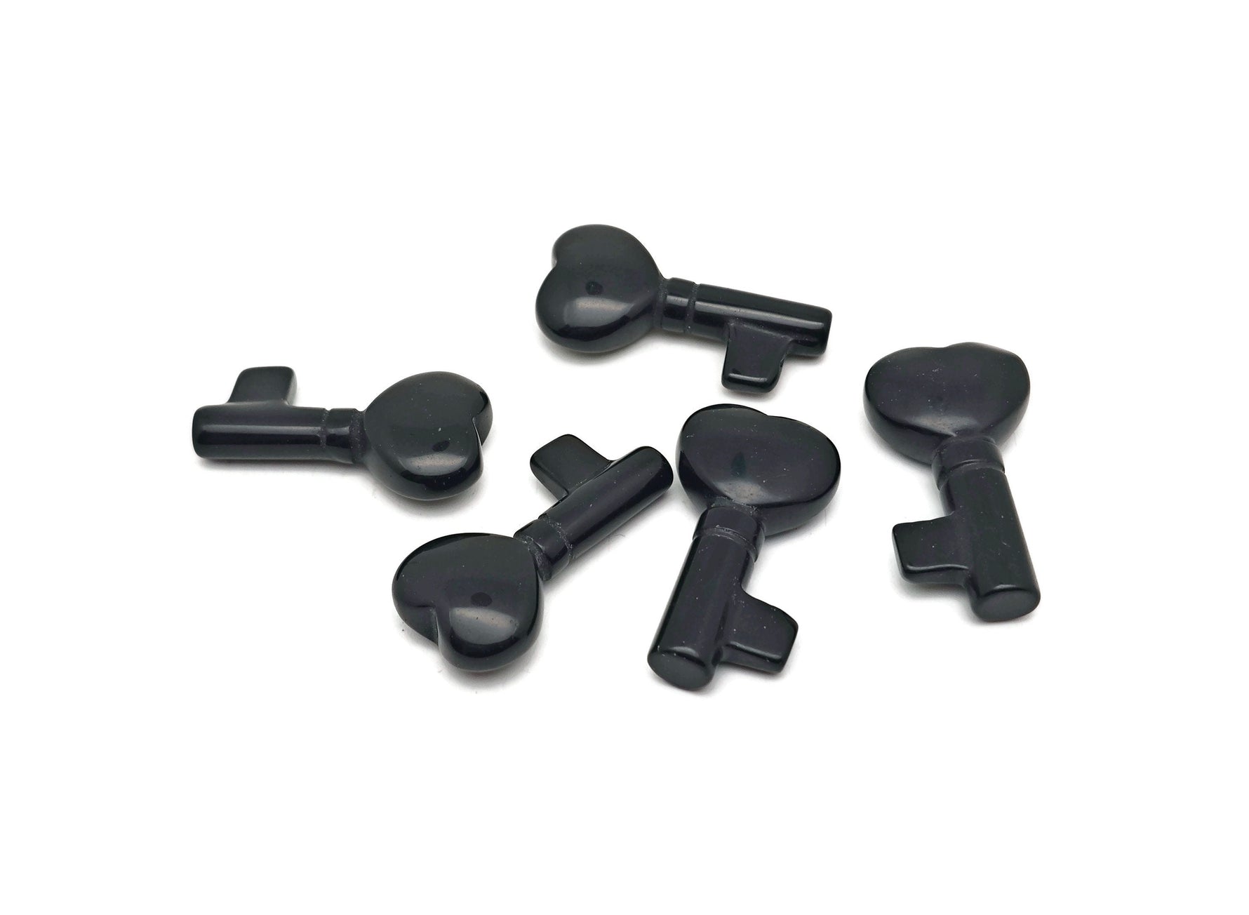 Obsidian key gemstone carving, 40mm, from GemstoneGO, featuring detailed craftsmanship and polished surface.