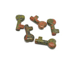 Unakite key gemstone carving, 40mm, from GemstoneGO, showing detailed natural pink and green mineral patterns.