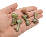 Unakite key gemstone carving, 40mm, from GemstoneGO, showing detailed green and pink mineral patterns on a polished surface.