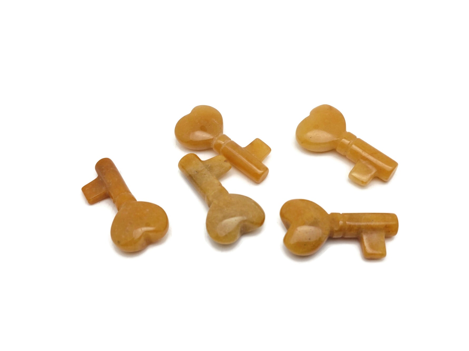 Yellow jade key gemstone carving, 40mm, detailed yellow jade key sculpture by GemstoneGO, showcasing craftsmanship and vibrant color.