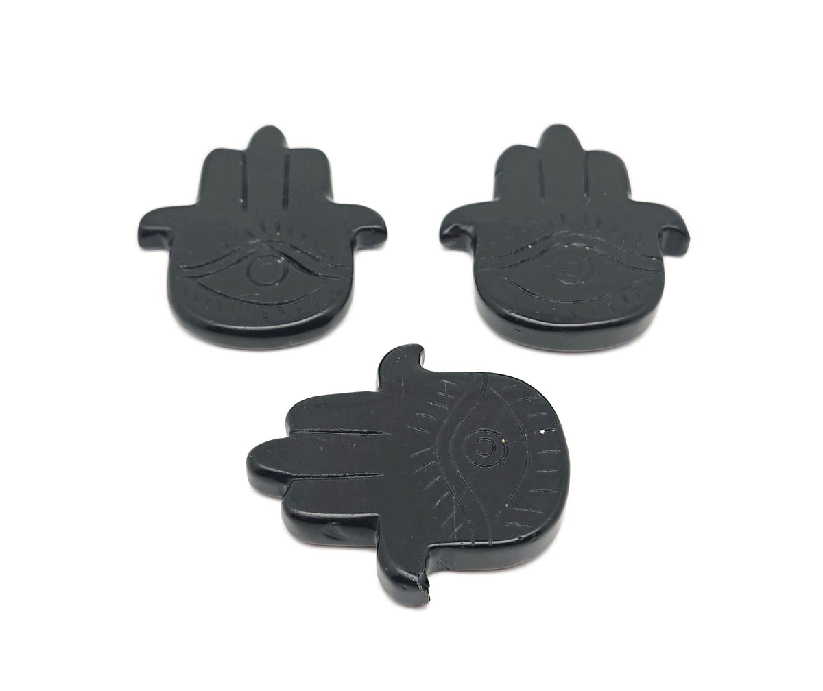 Obsidian Evil Eye hand gemstone carving with intricate details, designed for protection and spiritual significance by GemstoneGO.