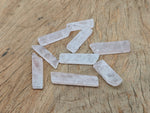 Rose quartz tumbled gemstone pendant with drilled hole, natural pink stone from GemstoneGO.