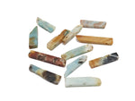 Caribbean calcite drilled tumbled gemstone pendant from GemstoneGO showcasing polished, vibrant orange and yellow hues with natural patterns.
