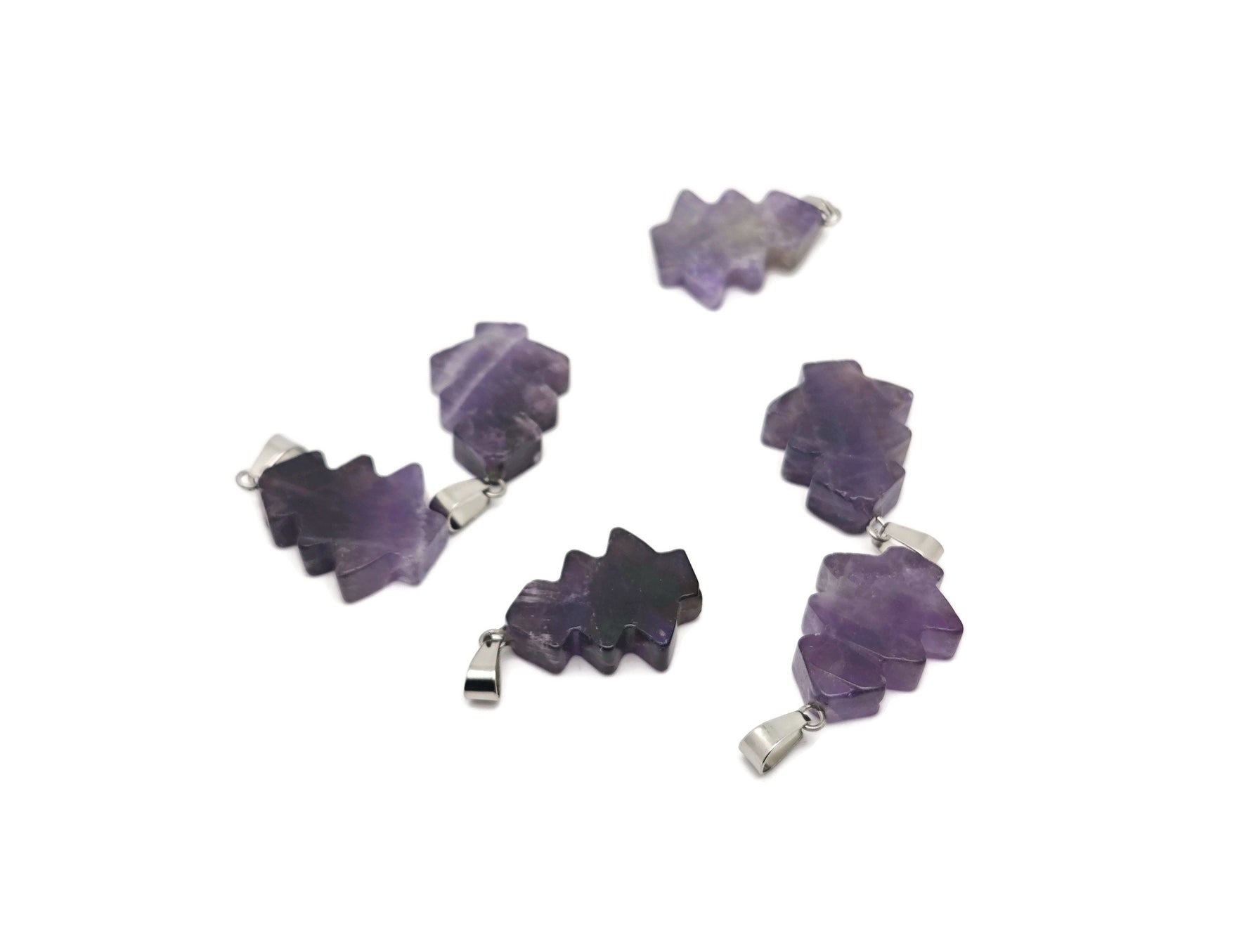 Mini amethyst gemstone pine tree pendant by GemstoneGO, featuring a detailed crystal pine tree design.