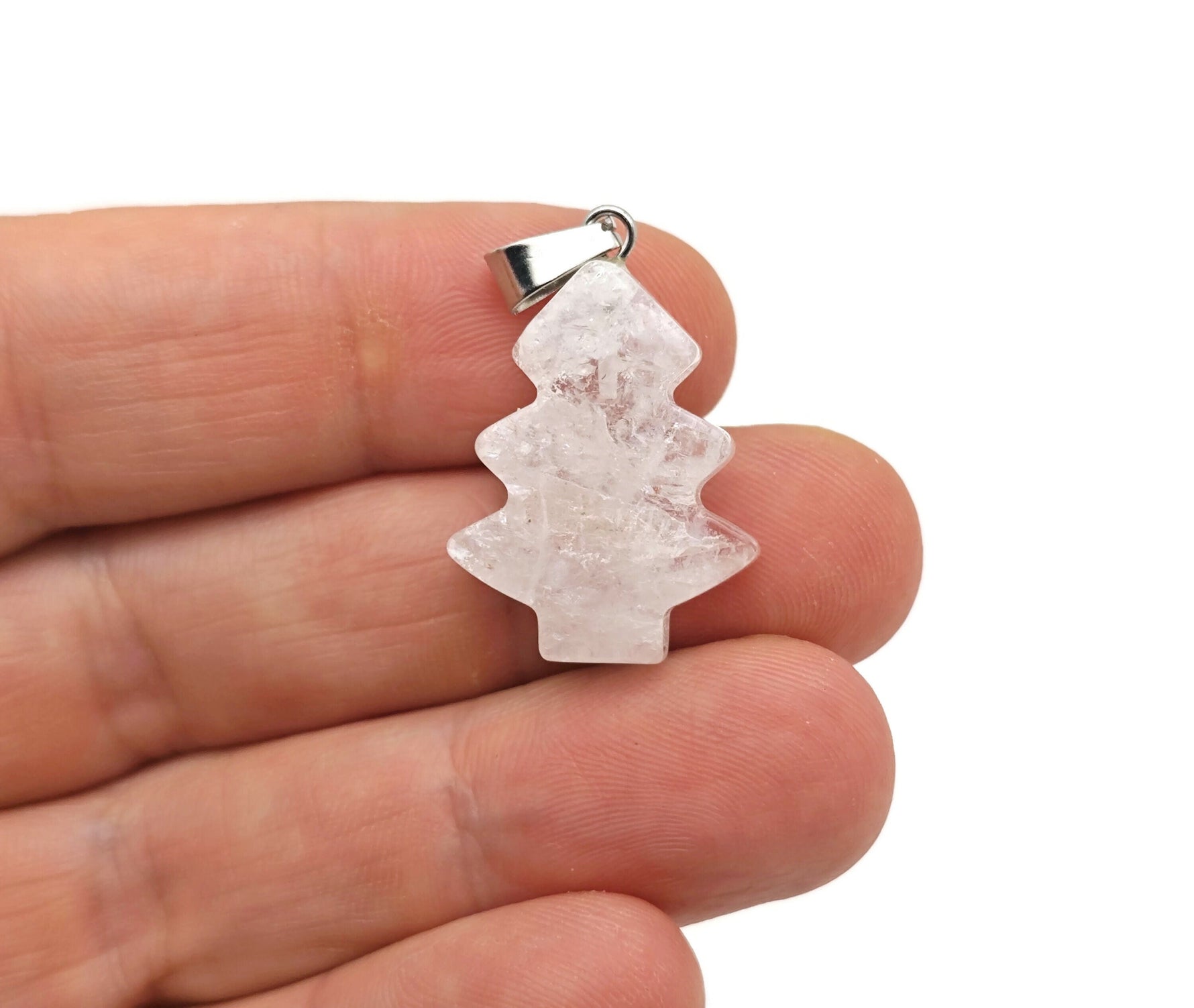 Clear quartz pine tree gemstone pendant featuring a mini crystal design from GemstoneGO, showcasing a detailed nature-inspired pendant.