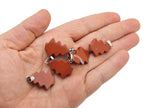 Red Jasper Pine Tree gemstone pendant featuring a mini crystal design, showcasing a detailed red jasper pine tree on a silver setting.