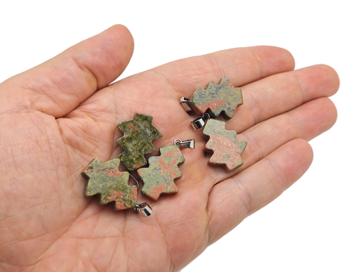Unakite gemstone pine tree pendant hanging from a silver chain, mini crystal jewelry design, crafted by GemstoneGO.