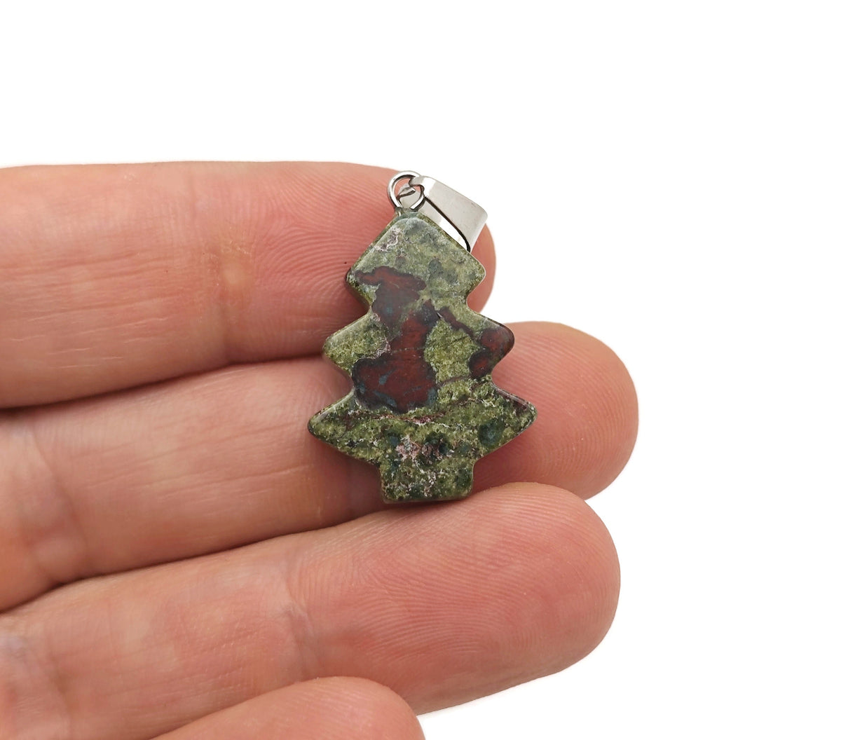 Mini Dragon Blood Jasper gemstone pendant featuring a pine tree design, crafted by GemstoneGO, showcasing rich red and brown tones.