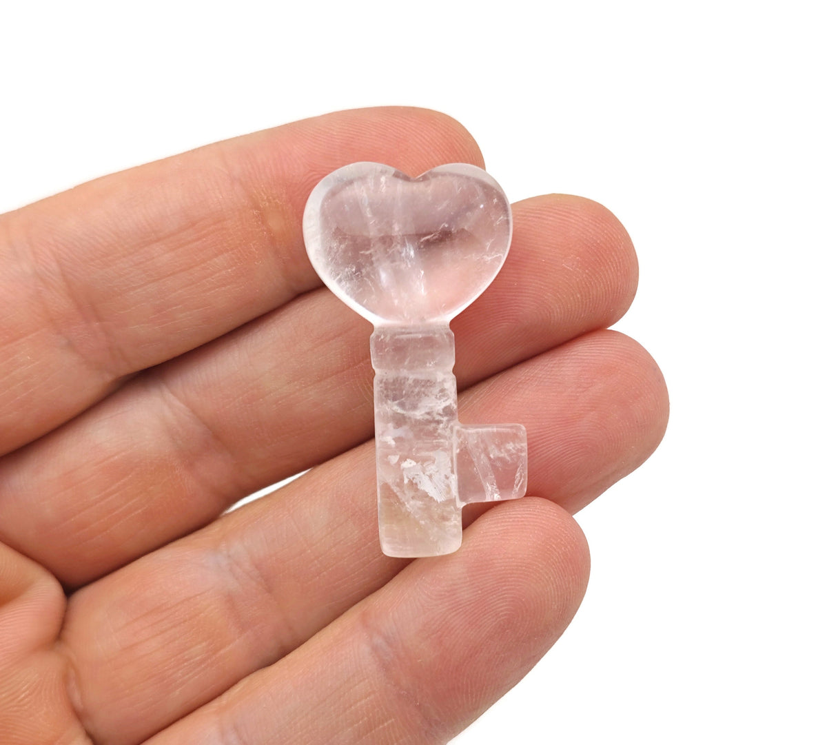 Clear quartz key gemstone carving, 40mm, with intricate details and polished finish, made by GemstoneGO.