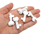 Howlite gemstone key carving, 40mm, from GemstoneGO, featuring polished white stone with gray veining and detailed carving design.