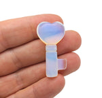 Opalite gemstone key carving, 40mm size, by GemstoneGO, showing smooth, polished surface with subtle iridescent glow.
