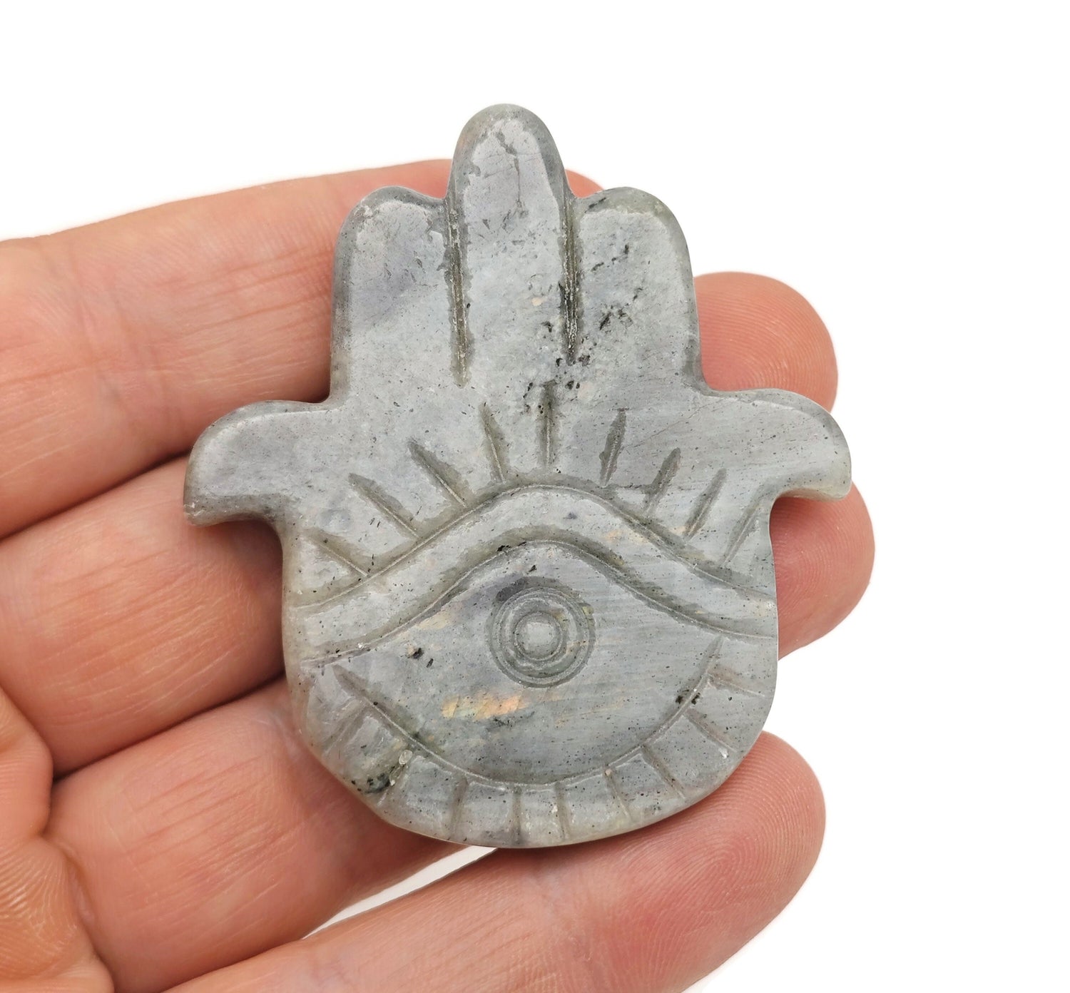 Labradorite evil eye hand gemstone carving with intricate details, showcasing vibrant labradorite colors and protective symbolism.