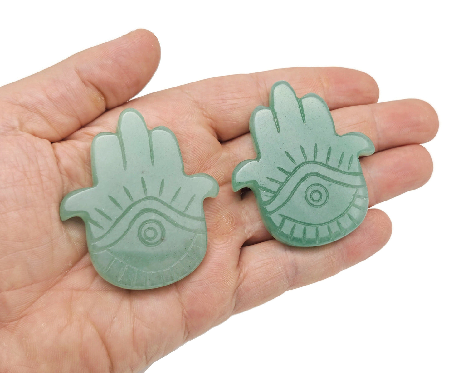 Aventurine evil eye hand gemstone carving from GemstoneGO, featuring intricate detailing and vibrant green gemstone material.