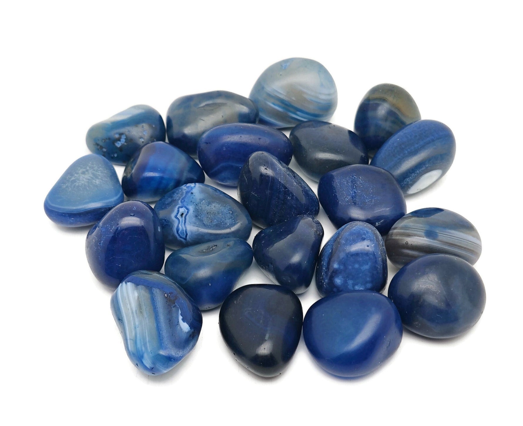 Blue Agate tumbled stone from GemstoneGO showing smooth, polished blue agate with natural banding and glossy finish.