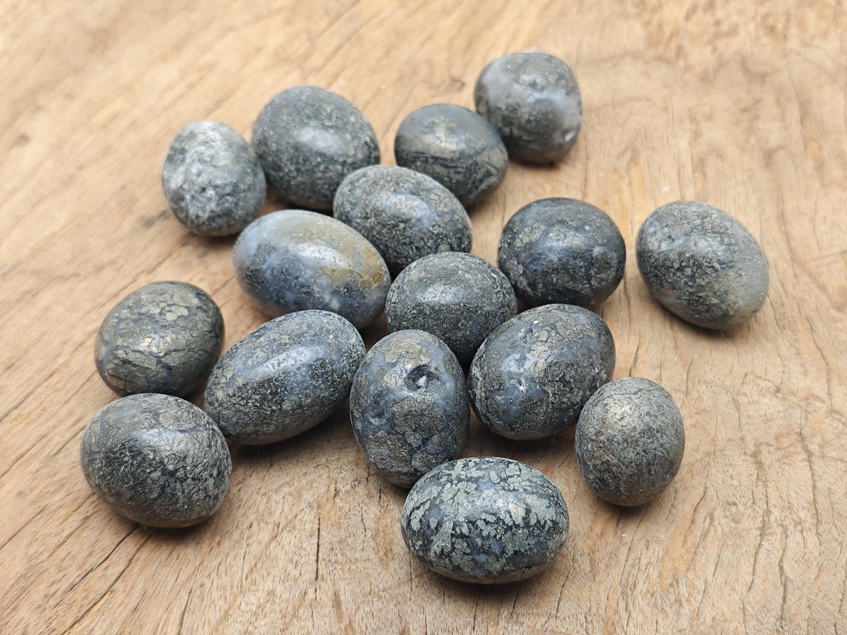 Cooper Agate tumbled stone from GemstoneGO, showing smooth, polished brown and beige banded gemstone with natural patterns.