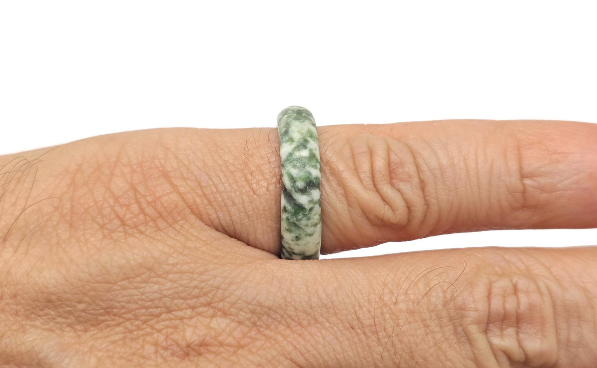 Green Jade Crystal Ring featuring a polished jade stone set in a silver band, showcasing intricate gemstone craftsmanship.