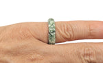 Green Jade Crystal Ring featuring a polished jade stone set in a silver band, showcasing intricate gemstone craftsmanship.