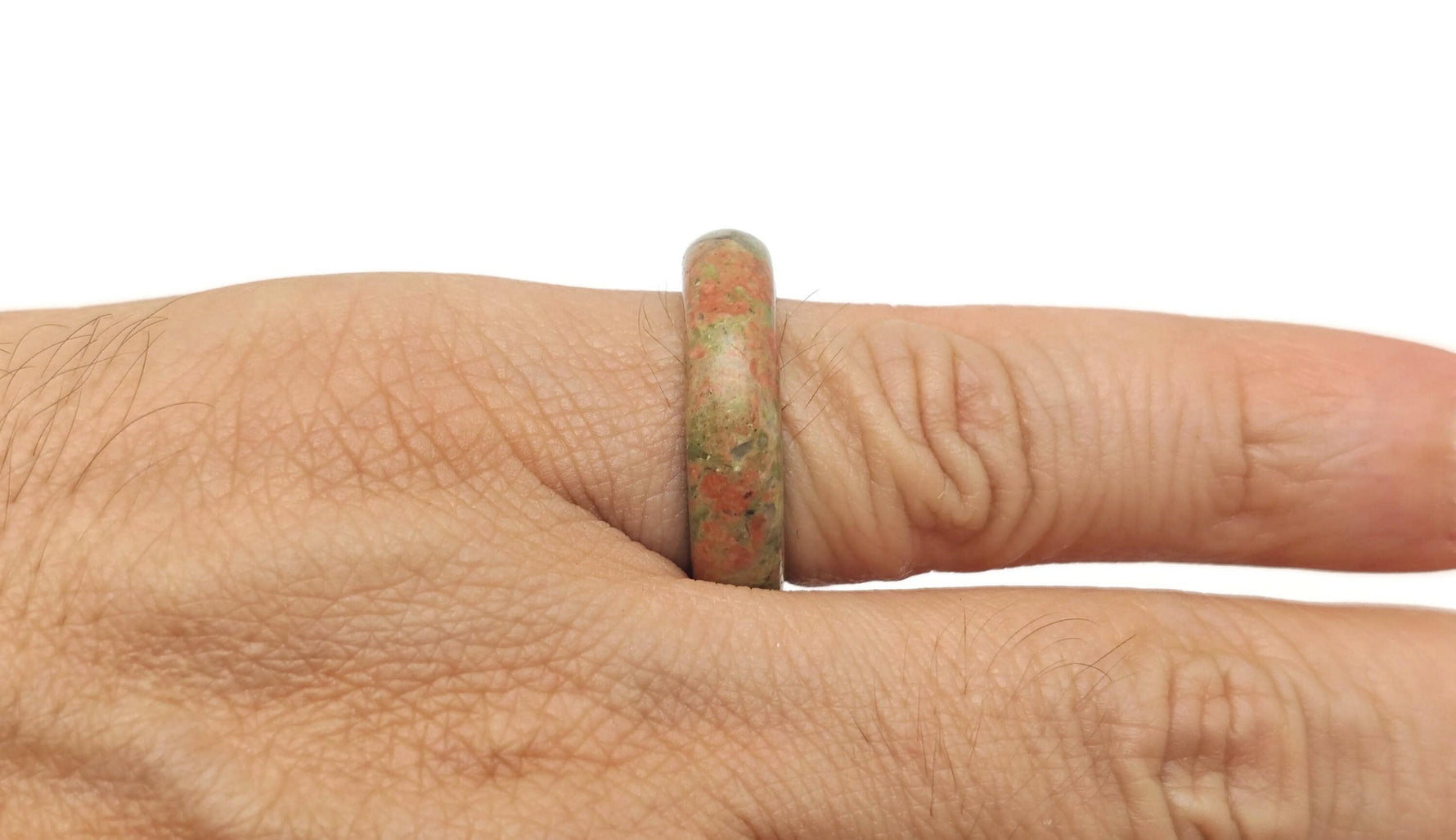 Unakite crystal ring by GemstoneGO featuring a polished green and peach gemstone set in a silver band.