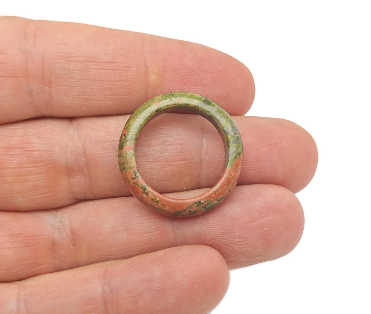 Unakite crystal ring by GemstoneGO featuring a polished green and pink gemstone set in silver jewelry.