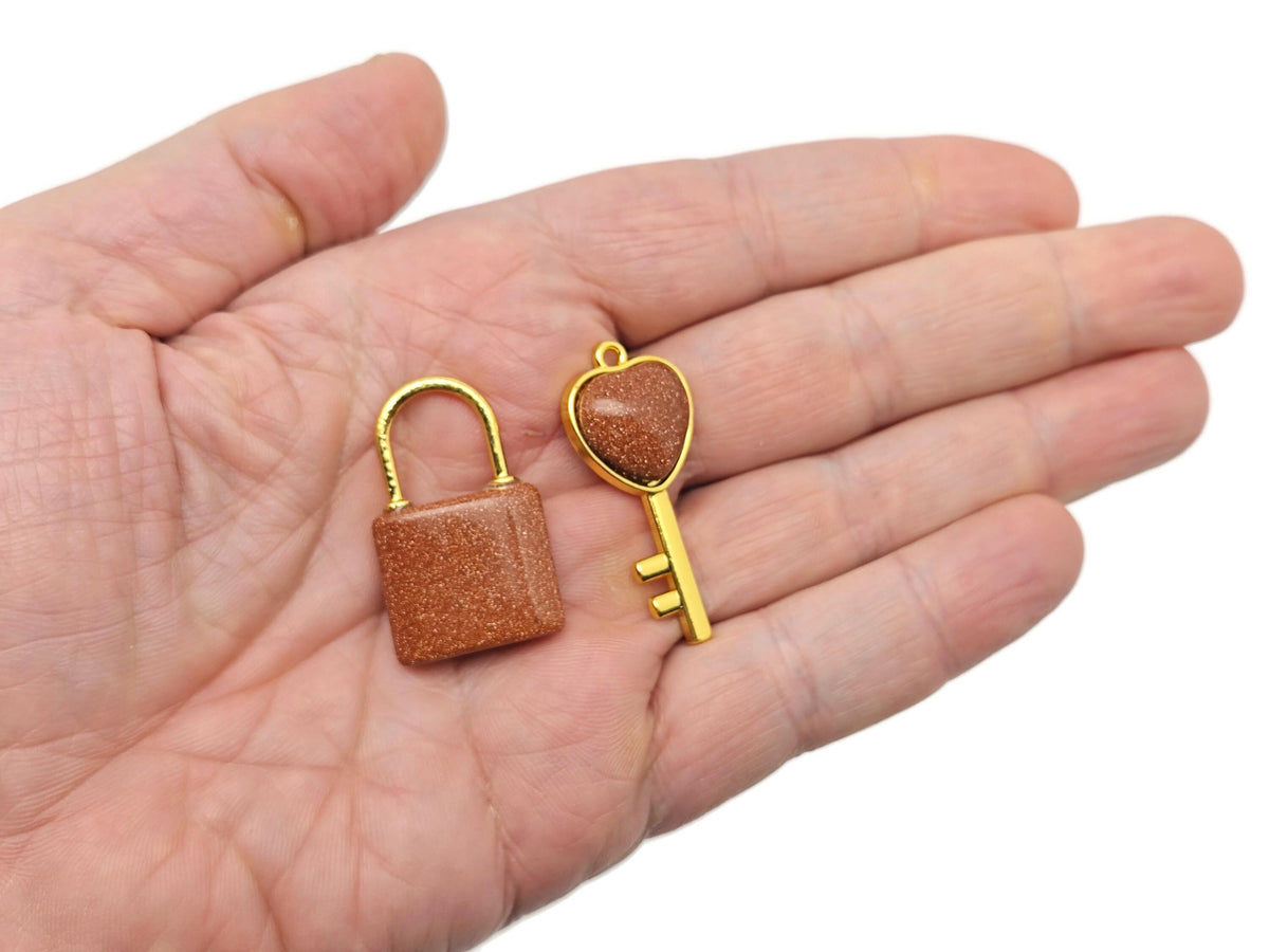 Goldstone Heart Key Crystal Pendant by GemstoneGO featuring a shimmering goldstone heart-shaped crystal on a silver chain