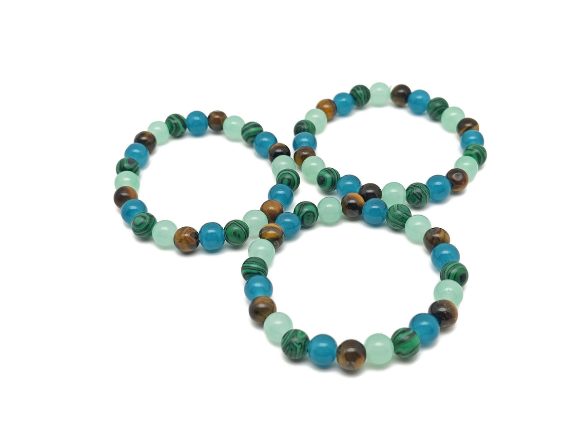 Handmade gemstone intention bracelet with colorful beads and a silver charm, designed for positive energy and style.