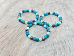 Handmade gemstone bracelet with colorful beads and charm, designed for intention setting by GemstoneGO