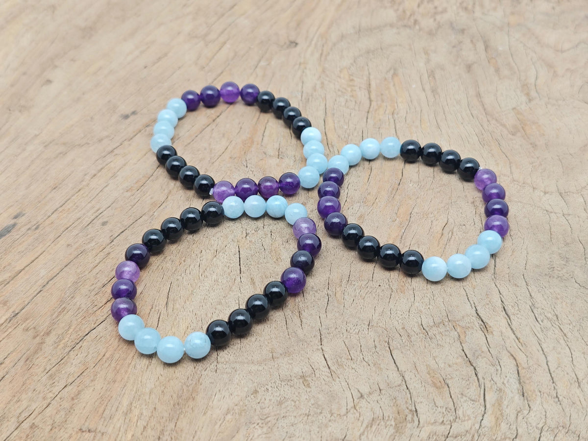 Handmade gemstone bracelet with colorful stones, designed for pain relief and positive intentions by GemstoneGO.