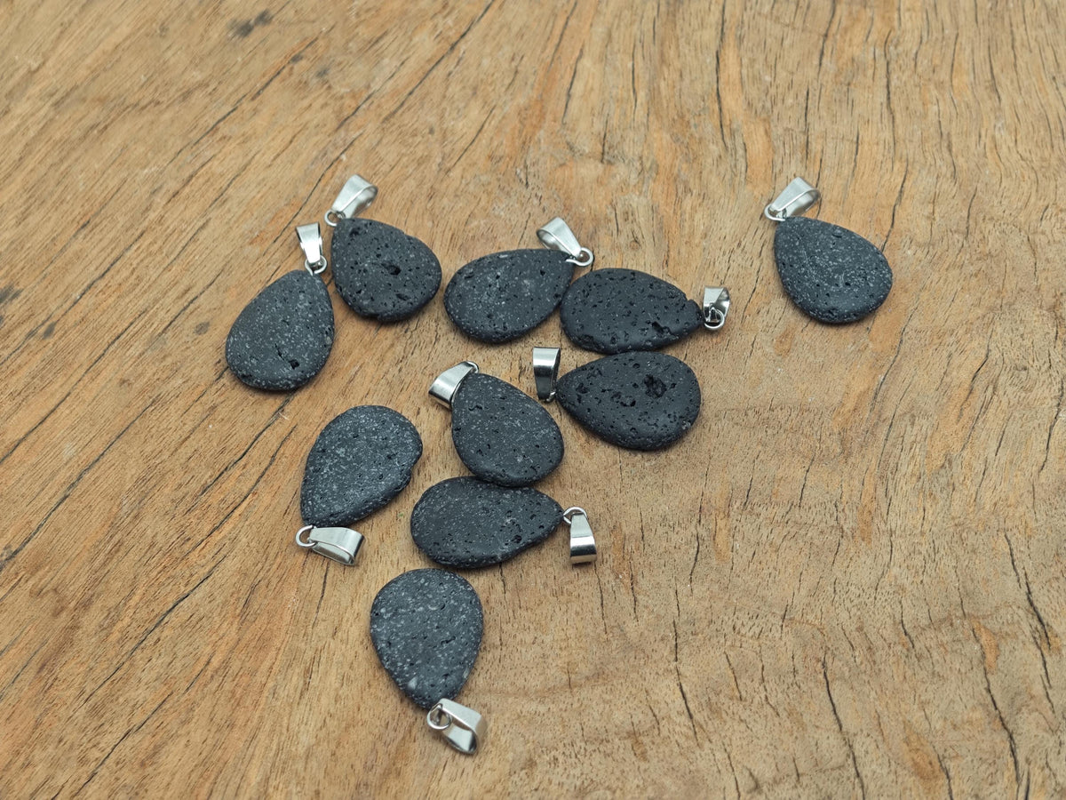Lava crystal pendant featuring a spiritual stone design from GemstoneGO, showcasing a black volcanic rock pendant with intricate carvings.