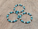 Handmade crystal healing gemstone bracelet with colorful beads and adjustable cord, designed for intention and positive energy.