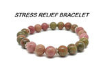 Handmade gemstone bracelet with colorful beads, designed for stress relief and positive intentions, by GemstoneGO.