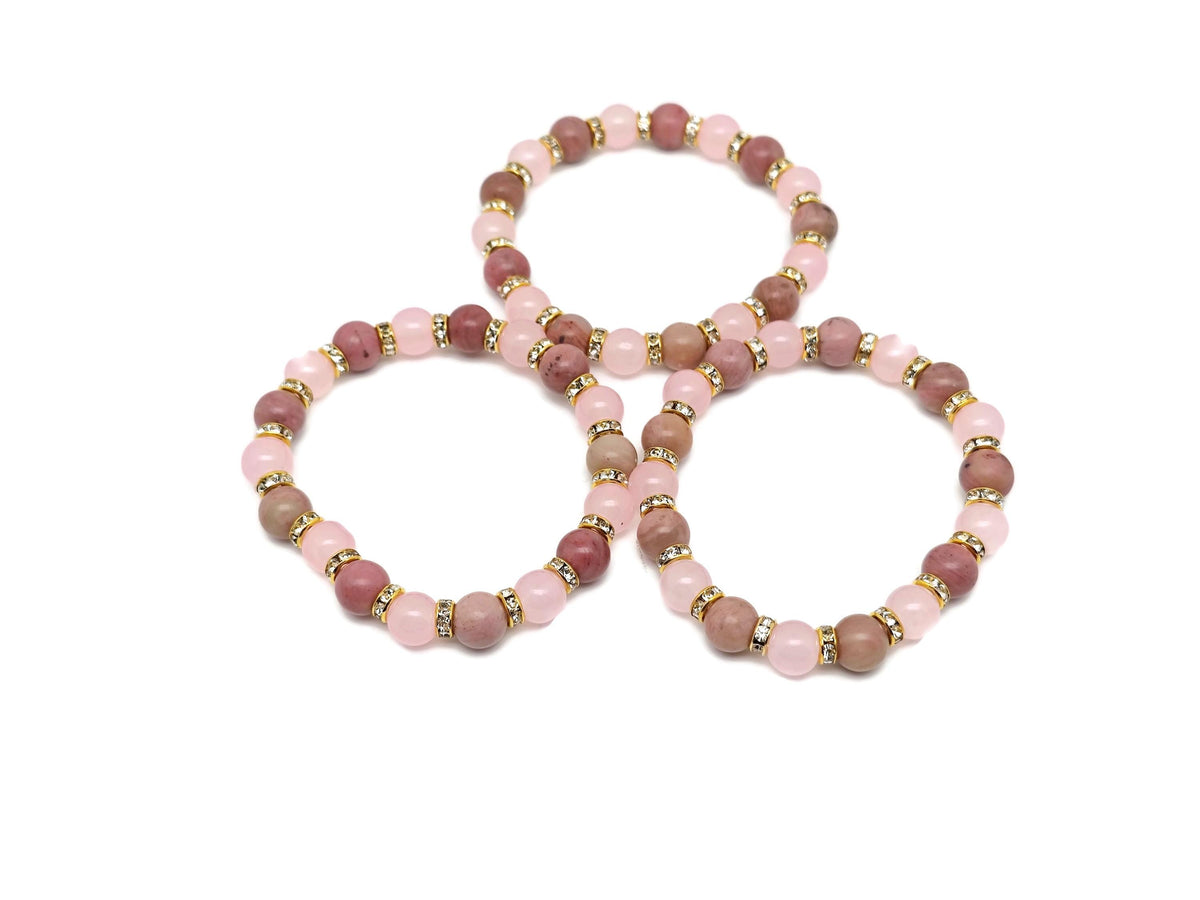 Handmade empowerment gemstone bracelet with colorful beads and a central charm, designed for intention and positive energy.
