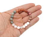 Handmade self-love gemstone bracelet with colorful beads, designed for positive intentions and personal empowerment by GemstoneGO.
