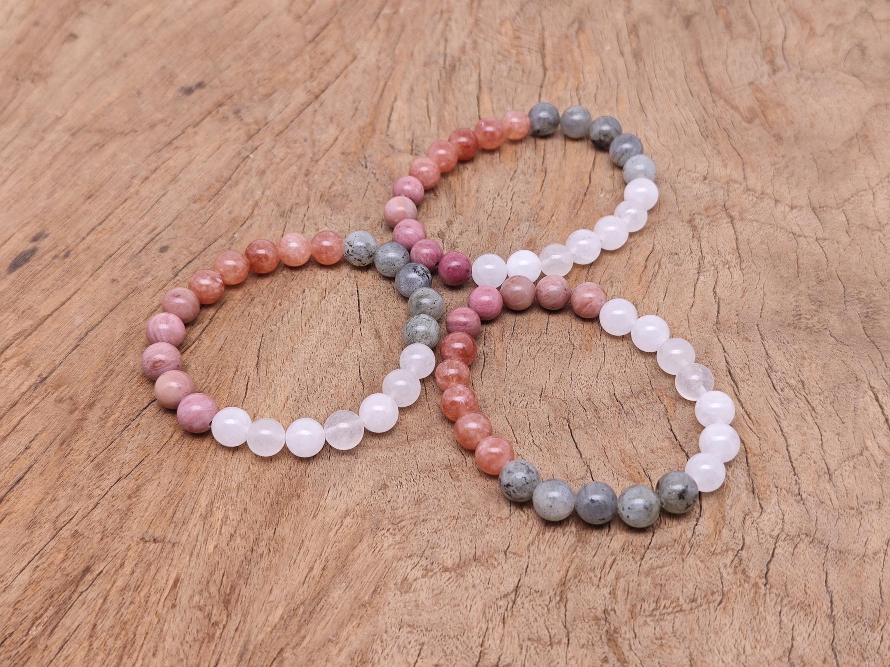 Handmade self-love gemstone bracelet with colorful beads and a silver clasp, designed for positive intentions and personal empowerment.