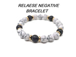 Handmade gemstone bracelet with negative energy-releasing stones, featuring colorful beads and a secure clasp by GemstoneGO.