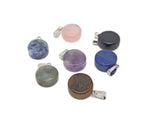 Round gemstone pendant featuring a clear crystal cabochon, showcasing a smooth, polished surface and vibrant gemstone colors by GemstoneGO.