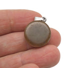 Flat round gemstone pendant featuring a crystal coin cabochon in mixed colors, showcasing a loose gemstone with a smooth surface.