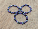 Handmade gemstone bracelet with smooth beads, designed for intention and soothing energy, by GemstoneGO.